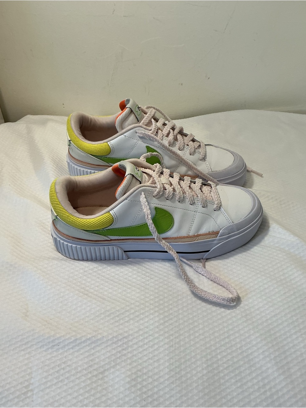 Nike White Low-Top Sneakers with Orange Tongue and Subtle Pink Lining